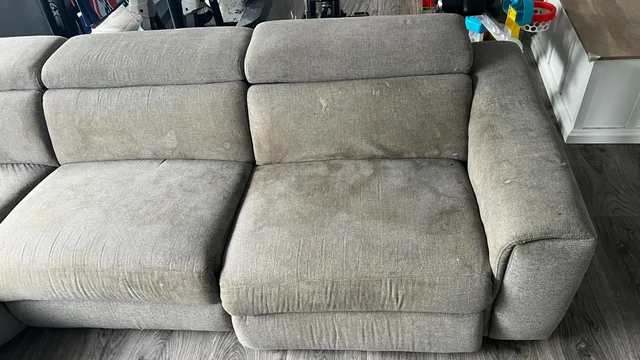 Grey fabric sofa before cleaning