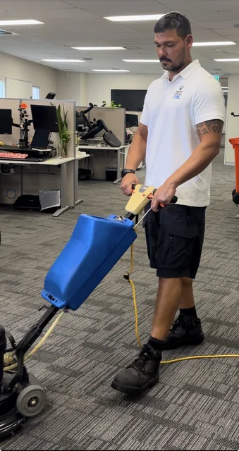 Office carpet pre-scrubbing in progress